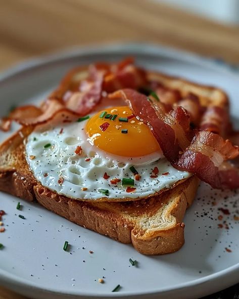 A delicious breakfast of bacon and eggs on toast. The bacon is crispy and the eggs are perfectly cooked with a runny yolk ->> more details in ai-img-gen.com Eggs And Bacon Breakfast Aesthetic, Eggs And Toast, Egg On Toast, Eggs On Toast, Runny Eggs, Eggs And Bacon, Breakfast Eggs, Bacon And Eggs, Toasted Bread