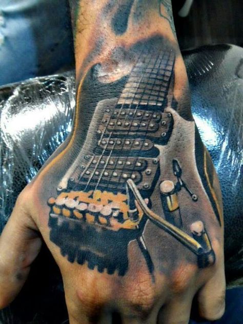 Guitar tattoo- very cool Tattoo Designs On Hand, Herren Hand Tattoos, Guitar Tattoo Design, Music Tattoo Sleeves, Men Masculine, Guitar Tattoo, Music Tattoo Designs, Masculine Design, Bad Tattoos