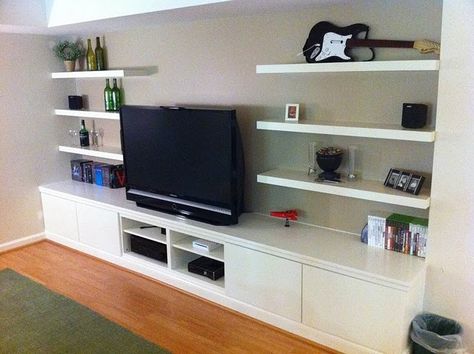 Thinking of adapting this idea to create an entertainment center in the living room. House Desine, Ikea Entertainment Center, Entertainment Shelves, Floating Shelves Entertainment Center, Wall Entertainment Center, Entertainment Center Wall Unit, Floating Entertainment Center, House Upgrades, Built In Entertainment Center