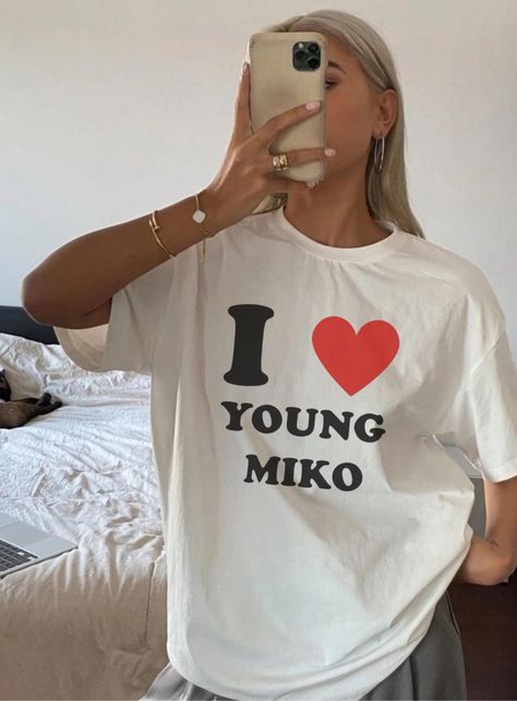 Introducing the "I ❤️ Young Miko" Unisex Heavy Cotton Tee--a must-have for fans who want to wear their admiration proudly. This tee is more than just a statement; it's a wardrobe essential. Crafted from 100% ethically sourced US cotton, this medium-weight fabric (5.3 oz/yd²) offers the perfect balance of comfort and durability, making it ideal for year-round wear. The shirt's classic fit ensures a relaxed feel, while the crew neckline gives it a clean, timeless look that works for both casual an Young Miko, Writing Therapy, Fan Shirts, Mood Pics, Wardrobe Essentials, Heavy Cotton, Cotton Tee, Gender Neutral, Bathing Beauties