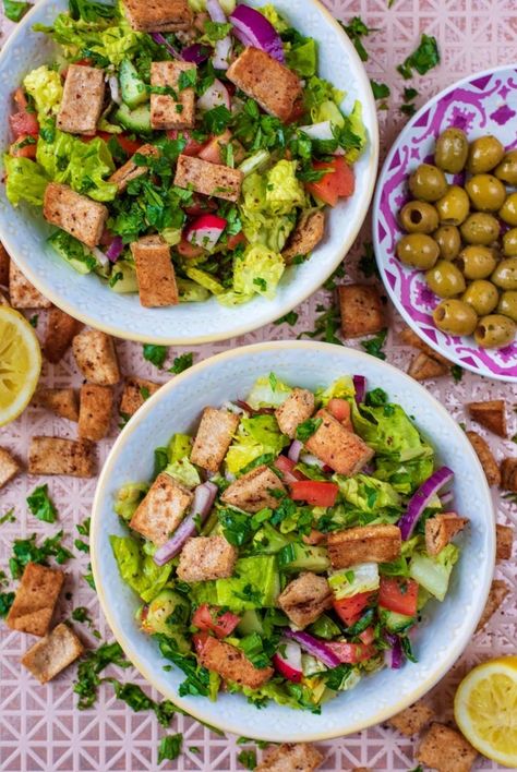 A Fattoush Salad (basically a bread salad) is a Middle Eastern staple and the lemon and mint dressing just brings it all together. This crunchy and zesty chopped salad is topped with homemade baked pita chips, making it a great way to use up stale pita bread. A great fridge clear out salad and a welcome addition to a BBQ or picnic. #fattoush #salad #middleeastern #levantine Mint Dressing, Baked Pita Chips, Lemon And Mint, Fattoush Salad, Lunch Inspiration, Bread Salad, Mediterranean Salad, Healthy Lunchbox, Healthy Sandwiches