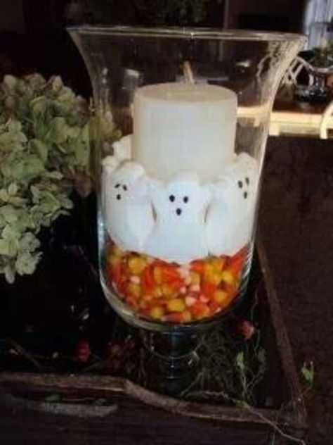 50+ Spookily Cute DIY Halloween Baby Shower Ideas | HubPages Candy Corn Centerpiece Ideas, Ghost Centerpieces Diy, Diy Halloween Baby, Ghost Peeps, Halloween Baby Shower Ideas, Baby Bottle Favors, Decorative Shelves, Halloween Candle, Halloween Centerpiece