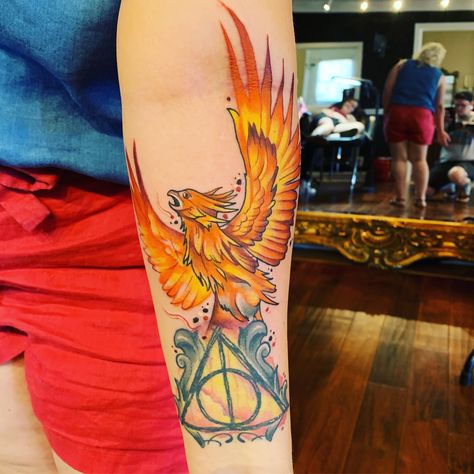 The Phoenix was and addition to the Deathly Hallows Harry Potter Fawkes Tattoo, Fawkes Tattoo Harry Potter, Phoenix Tattoo Design Harry Potter, Deathly Hallows Phoenix Tattoo, Floral Deathly Hallows Tattoo, Harry Potter Deathly Hallows, The Deathly Hallows, Phoenix Tattoo, Deathly Hallows