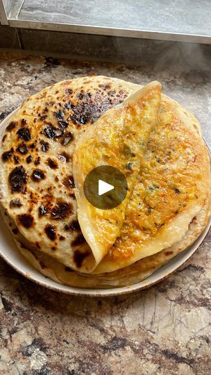 146K views · 12K reactions | Here’s my ✨special✨aloo paratha recipe. A classic Punjabi breakfast (or dinner) with a cheesy, spicy twist. You’re going to absolutely love this one guys! Try it this weekend. Recipe below 👇🏾 

8 parathas:

500g flour
4 tablespoons yoghurt
1/4-1/2 cup boiling water 
1/2 salt
1 tsp sugar 
4 medium potatoes
1 small onion
2 tsp garam masala
1.5 tsp chilli powder
1/2 tsp black better
1/8 tsp turmeric
Salt to taste
Corriander 
Mature cheddar
Chilli oil

#alooparathas #alooparatharecipe #alookiparathas #paratharecipe | Zaynah | Desified Recipes & Travel Punjabi Breakfast, Chai Party, Yummy Asian Food, Weekend Recipe, Aloo Paratha, Paratha Recipe, Chilli Oil, Paratha Recipes, Curry Dishes