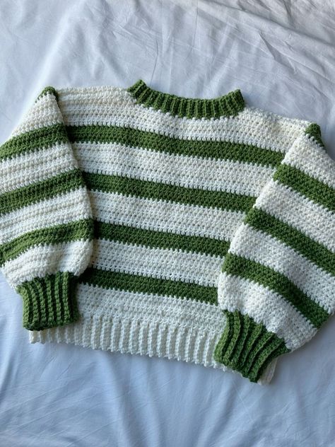 This beginner-friendly crochet blanket is easy to follow and creates a beautiful and cozy blanket for your home. We also offer a variety of free and paid crochet patterns on other topics.. #Striped_Crochet_Pullover #Green_And_White_Crochet_Sweater #Chunky_Crochet_Pullover_Pattern_Free #Crochet_Cozy_Sweater Green And White Crochet Sweater, Crochet Sweater One Piece, Stripped Sweater Crochet, 2 Color Crochet Sweater, Crochet Sweater Striped, Free Crochet Patterns For Clothes, Two Color Crochet Sweater, Crochet Sweater Fall, Green Sweater Crochet