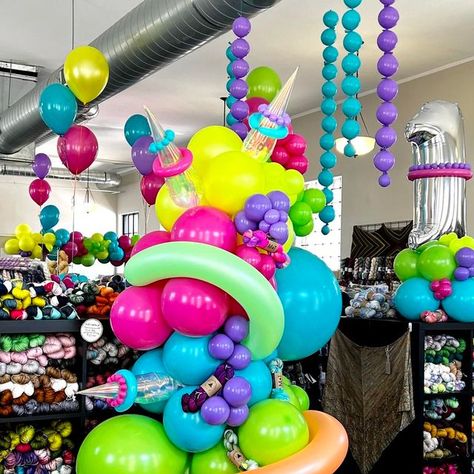 POP POP BALLOON on Instagram: "We went full 80's neon balloons for the 19th anniversary of @simplysocksyarnco . We wanted it to be fun and a little extra.  . We even tried a few new things with this balloon garland including these huge tube looking balloons!  .  If your business is looking to draw some attention then look no further.  . If you are in our near the Fort Wayne Indiana area comment "link" below and we will DM you our info :)  .  #poppopballoonfw #fortwayneballoons #balloongarland #balloonarch #neonballoons #80sparty #80sdesign #neonparty" 80s Balloons, Neon Balloons, 19th Anniversary, 80s Neon, 80s Design, Fort Wayne Indiana, 80s Party, Neon Party, Pop Pop