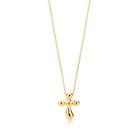 Elsa Peretti® cross pendant in 18k gold, 14 mm wide. Tiffany Cross Necklace, Tiffany Cross, Drop Necklaces, Diamond Drop Necklace, Bridal Jewelry Necklace, Tiffany Necklace, Star Of David Pendant, Heart Pendants, Gold Cross Necklace