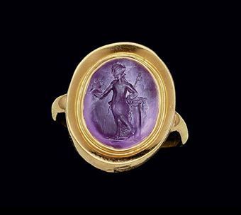 A Roman amethyst ringstone. Circa 1st-2nd century A.D. Photo: Christie's Images Ltd. 2010 The convex oval stone engraved with Venus Victrix, nude but for a mantle draped around her waist, leaning against a column, holding a spear in her left hand and a helmet in her outstretched right; mounted as a ring in a modern gold setting 9/16 in. (1.4 cm) long; ring size 8½. Estimate $1,500- $2,000. Price Realized $2,750 Provenance: Private Collection, Paris, acquired in the 1980s. Ancient Accessories, Roman Rings, Roman Jewellery, Intaglio Jewelry, Intaglio Ring, Etruscan Jewelry, Ancient Roman Jewelry, Ancient Jewels, Roman Jewelry