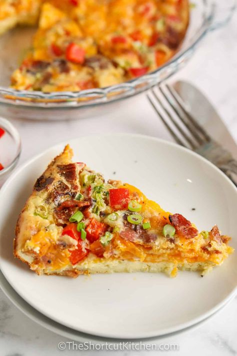 This light and fluffy Crustless Bacon Quiche Recipe is easy to make and is perfect for breakfast, lunch, or dinner! Using flavorful ingredients like bacon and cheddar, other ingredients like ham or sausage, asparagus, or spinach can also be used. Just follow the basic egg recipe and enjoy. #baconquicherecipe #theshortcutkitchen #baconquiche #bisquickquiche Bacon Onion Quiche, Recipe With Bisquick, Quiche With Bacon, Breakfast Quiche Recipes Easy, Bacon Quiche Recipe, Bacon And Cheese Quiche, Spinach Quiche Recipes, Breakfast Quiche Recipes, Quiche Recipes Easy