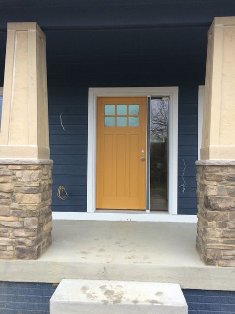 Front door is Honeycomb from Sherwin Williams. Sherwin Williams Honeycomb, Gold Front Door, Honed Granite Countertops, Cost Of Granite Countertops, Kohler Kitchen Faucet, Exterior Paint Schemes, Door Paint, Colour Trend, Family Cabin