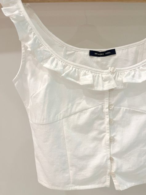 The perfect top for any outdoorsy activity this summer, our sleeveless top features a scoop neckline with ruffle detail, a front button up closure with dainty white buttons, and a fitted, slightly cropped look. Material : Cotton 100% Size : One-size Measurements : Chest 37cm, Length 42cm Wash Instructions : Cold wash only, do not tumble dry. Ruffle Top, British Indian, Scoop Neckline, This Summer, Jacket Dress, Sleeveless Top, Coco, Shopping Outfit, Button Up