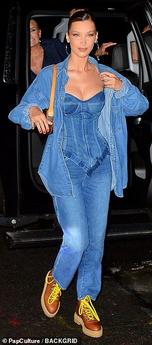 Supporting sister: She was joined by her sister Bella Hadid and a variety of fashion's big... #bellahadid Denim Corset Outfit, Corset Jewelry, Corset And Jeans, Louis Vuitton Earrings, Blue Denim Top, Corset Outfits, Denim Corset Top, Corset Outfit, Bella Hadid Outfits