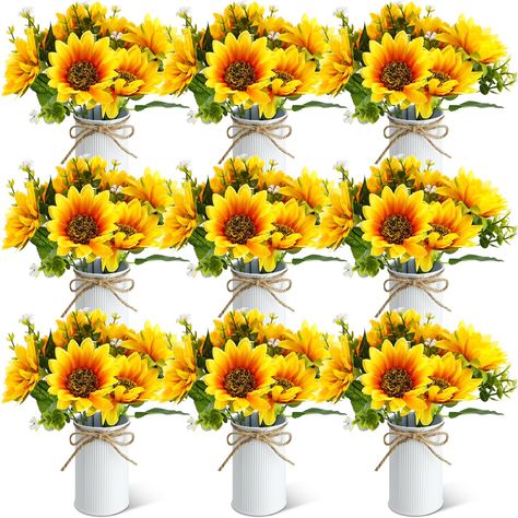 PRICES MAY VARY. An All Encompassing Package: this package is a complete aesthetic solution, including 9 artificial sunflowers, mainly in yellow and green and 9 pots in white color with a hemp twine bow, each sunflower has 7 flowers and leaves, providing you with everything you need from plastic and silk fabric sunflowers to galvanized tin pots in one inclusive bundle; It's an ideal arrangement for instant beautification of any space Vividly Beautiful and Lifelike: with the mainly yellow and gre