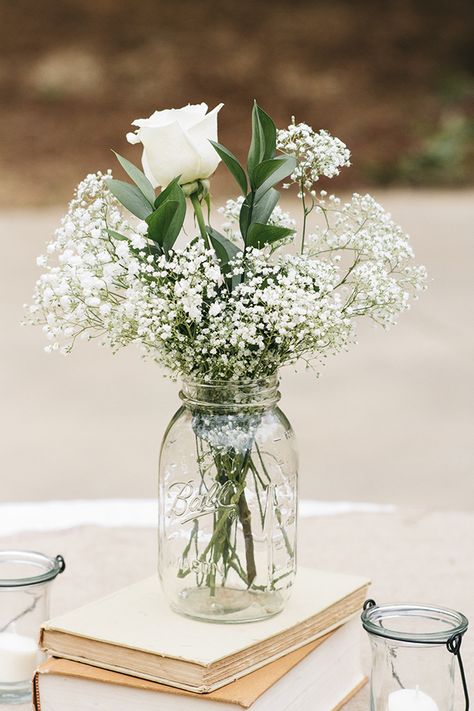 The reception centerpieces featured white roses and baby's breath in mason jars.  	Photo by J. Masciana Photography 	Flowers by Simply Beautiful Flowers & Events Affordable Wedding Centerpieces, Babies Breath, Simple Centerpieces, Wedding Table Decorations, Deco Floral, Wedding Table Centerpieces, Baby's Breath, Affordable Wedding, Rustic Wedding Decor