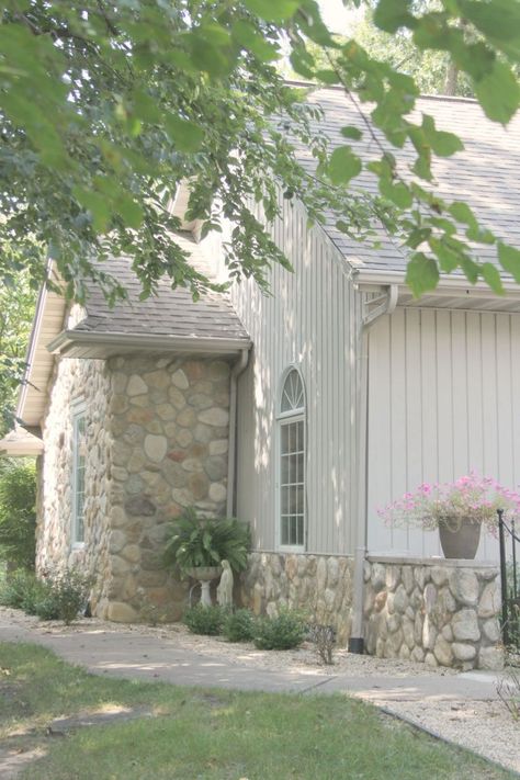 River rock stone accents on our European country inspired cottage exterior. #hellolovelystudio #cottagedesign #houseexterior #rivercottage #riverrock French Courtyard, Georgian Revival, Light Grey Paint Colors, White Exterior Paint, Church Conversions, Townhouse Interior, Meditation Garden, Paint Color Inspiration, Neutral Paint Color