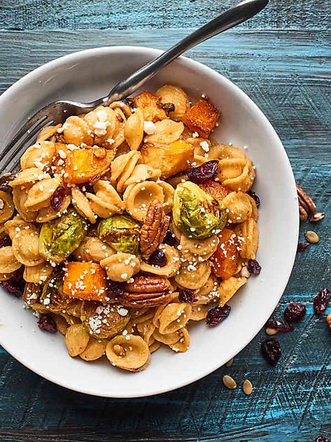 This Easy Roasted Fall Vegetable Pasta Recipe is full of roasted butternut squash and brussels sprouts, pecans, pumpkin seeds, goat cheese, and dried cranberries! showmetheyummy.com #fallpasta #roastedvegetables Butternut Squash And Brussels Sprouts, Fall Pasta Dishes, Autumn Pasta Recipes, Vegetable Pasta Recipes, Roasted Fall Vegetables, Fall Pasta, Roasted Vegetable Pasta, Fall Vegetables, Vegetable Pasta