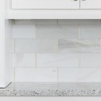 Honed White Tiles with Gold Trim Backsplash Herringbone, Brick Backsplash Kitchen, Juniper Home, Unique Backsplash, Beadboard Backsplash, Herringbone Backsplash, Brick Backsplash, Marble Backsplash, The Tile Shop