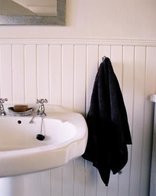 Although tile walls in a bathroom are functional, they often leave a lot to be desired aesthetically. Installing wainscoting, especially waterproof beadboard, can give the space the designer look you ... Wainscoting Height, Wainscoting Nursery, Wainscoting Hallway, Wainscoting Stairs, Wainscoting Kitchen, Faux Wainscoting, Installing Wainscoting, Painted Wainscoting, Wainscoting Bedroom