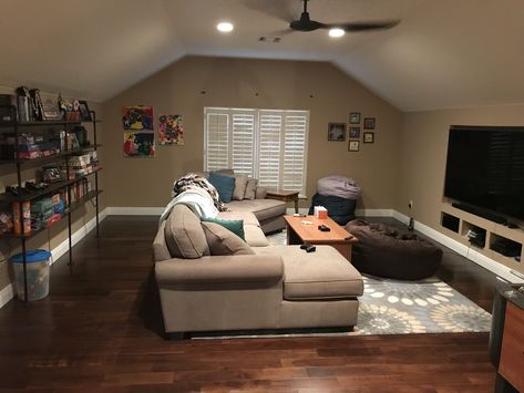 Bonus room over the garage ... now a teenage game room. Over The Garage Bonus Room Ideas, Rooms Over Garage Ideas, Attic Tv Room, Cape Cod Living Room Ideas, Attic Bonus Room Ideas, Above Garage Room, Garage Bonus Room Ideas, Attic Living Space, Attic Living Rooms