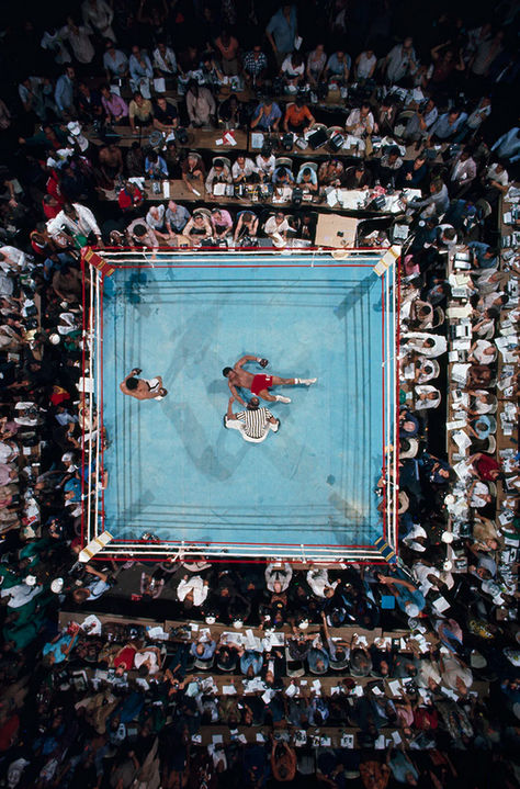 Kinshasa, Zaire. October 30, 1974. “Aerial view, shot from the rafters of Stade du 20 Mai Stadium in Kinshasa, Zaire, of Muhammad Ali pacing around George Foreman after an 8th round KO in the WBC/ WBA World Heavyweight Title, better known as the “Rumble in the Jungle.”⁣ Featured artist @neilleiferphotography #ClassicsMagazine #film #photography #specialfilm #35mmfilmphotography #filmisalive #keepfilmalive #longlivefilm #filmforever #vintagephotography #filmphoto #analogcamera #filmphotography Zach Clayton, Neil Leifer, Poster Grafico, Boxing Images, Rumble In The Jungle, Boxing Posters, Amoled Wallpapers, Cool Pictures For Wallpaper, George Foreman