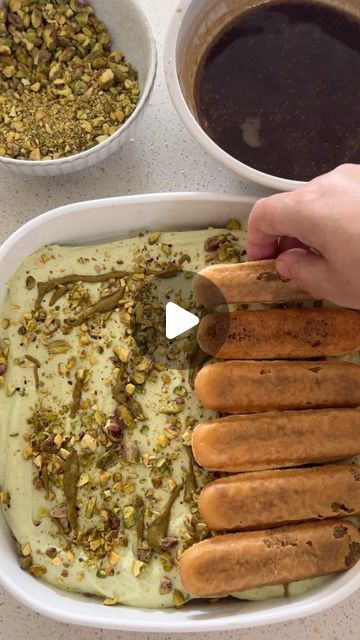 Fatimah Omran | Cooking and Baking on Instagram: "It seems my audience on other platforms had trouble understanding my voiceover on my last video. I can literally post a boiled potato and still get attacked… The only thing I like to attack is dessert and in particular anything with pistachios! Pistachio Tiramisu Recipe ⬇️ Ingredients 600ml thickened cream 400ml condensed Milk 4 tbsp pistachio paste 250gm mascarpone Crushed unsalted pistachio kernels 2 cups strong coffee Sponge fingers Method In a bowl, combine cream, condensed milk, pistachio paste and beat until thick. Add mascarpone and beat until well combined. In a tray, dip each sponge ginger lightly and spread side by side. Top with the cream and a sprinkling of crushed pistachio and repeat process until you’re le Pistachio Tiramisu Recipe, Pistachio Tiramisu, Non Bake Desserts, Tiramisu Cups, Pistachio Paste, Thickened Cream, Middle Eastern Desserts, Pistachio Cream, Tiramisu Recipe