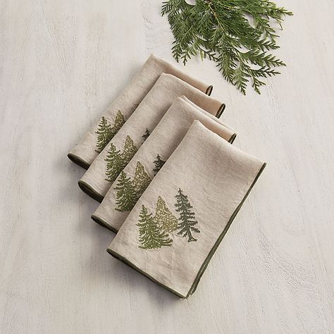 These lovely cloth napkins say holiday with warm, understated style. Designed by our talented resident artist, the charming evergreen tree motif is embroidered in three shades of green on soft flax linen. Each generously sized dinner napkin is trimmed in forest green to complement the subtly festive look. Evergreen Napkin features:  Made of 100% flax linen. Machine embroidered. Machine washable. Imported. Christmas Fairytale, Embroidered Trees, Christmas Linens, Christmas Cloth Napkins, Anniversary Candle, Christmas Linen, Embroidered Napkins, Embroidery Christmas, Setting Ideas