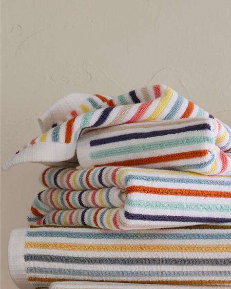 Refined stripes lend their playful edge to this absorbent bath towel of 100% long staple combed Aegean cotton. Ribbed 650-gram terry front and back. This product meets Standard 100 by OEKO-TEX. Striped dobby hem at both ends. Sides are finished with a clean white hem. Ribbed multi-stripe 650-gram cotton bath towels by Garnet Hill. Blue Bath, Striped Towels, Garnet Hill, Cotton Bath Towels, Kids' Bathroom, Mini House, Hand Towel, Bath Towel, Bath Towels