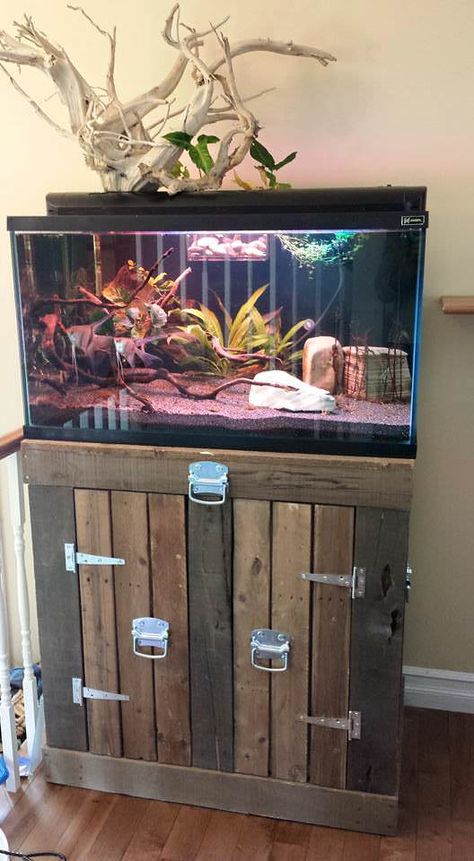 I used pallets for all the built. Removed all the nails and used only the wood from the pallets. I didn’t bought anything only screws and hinges. The stain was done by using a mix of different vinegars (white, red wine, apple cider) and steel wool. After different time of resting, of cut i... #Aquarium, #LivingRoom, #RecyclingWoodPallets, #Stand Aquarium Stand Ideas, Aquarium Furniture, Diy Aquarium Stand, Aquarium Stands, Fish Stand, Aquarium Set, Fish Tank Stand, Pallet Tv Stands, Aquarium Stand