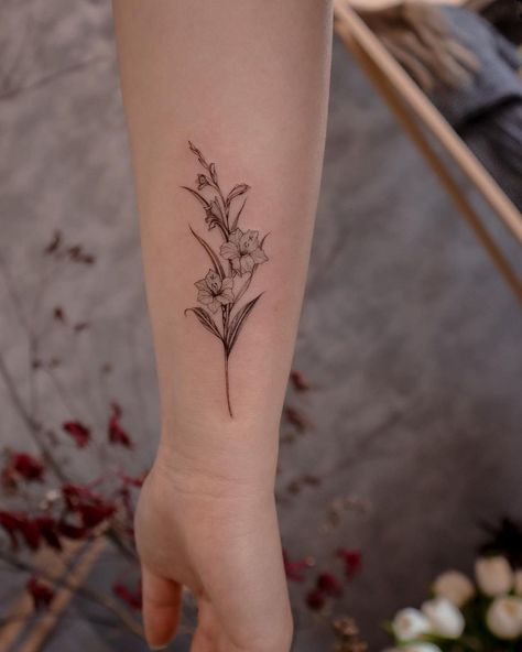 Forearm Daffodil Tattoo, Marigold And Gladiolus Flower Tattoo, Daffodil Tattoo Forearm, Tattoo Inner Forearm Woman, Gladiolus And Aster Tattoo, Gladiola Tattoo Small, Gladiolus And Daffodil Tattoo, Gladiolus Flower Tattoo Design, Gladiolus Flower Drawing Simple