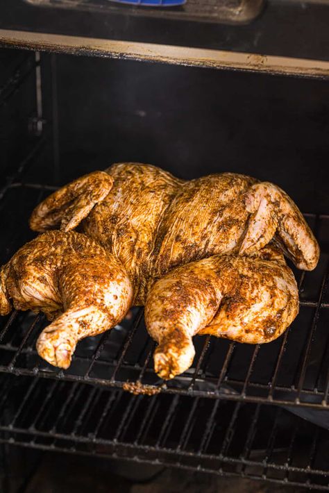 Spatchcock Smoked Chicken is a whole chicken cut to lay flat, covered in a delicious dry rub, and smoked to tender moist perfection. The deep rich hardwood smoke flavor is infused into the entire chicken. The mouthwatering homemade dry rub and optional whiskey BBQ sauce really takes this main dish over the top! #spatchcock #smoked #chicken #grilling #dryrub Patch Couch, Whiskey Bbq Sauce, Homemade Dry Rub, Smoked Chicken, Dry Rub, Whole Chicken, Bbq Sauce, Main Dish, Lay Flat