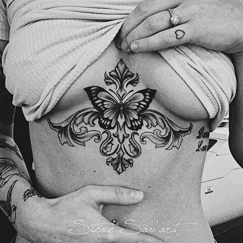 Cool Underboob Tattoo, Breast Lift Tattoo Cover Up, Underboob Tattoos For Women Unique, Underboob Tattoo Coverup, Underboob Tattoo Butterfly, Gothic Underboob Tattoo, Flower Tattoo Under Breast, Underboob Butterfly Tattoo, Under Bobs Tattoos