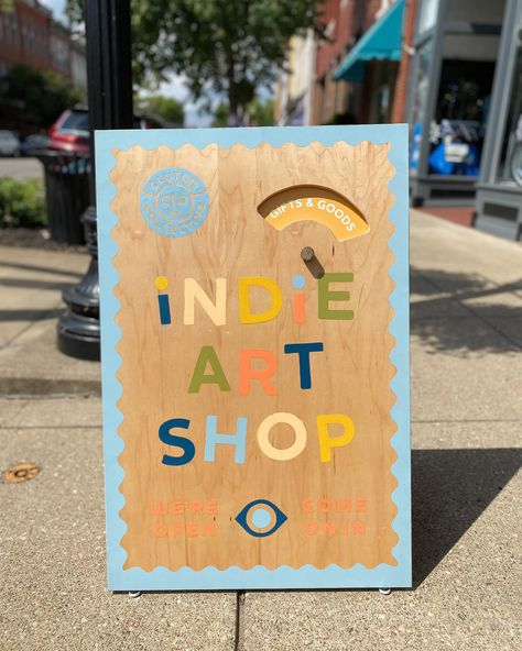 Have you seen our new sandwich board?! 😍 We are in love with this beauty! @a.n.creative came up with the design and hand-painted the sandwich board, which was fabricated by my husband, Nick. We wanted it to be fun, inviting, and cheerful, just like our shop 🙌 The spinning wheel makes it extra fun and lets us promote our artist pop-ups and live music. We think it’s just perfect and are so grateful to @americanexpress and @natlmainstreet for the Backing Small Businesses Grant that funded this ... Sandwich Board Sign, Sandwich Board Signs, Sandwich Board, Trust In Relationships, Indie Art, Business Grants, Interior Display, Small Business Saturday, Spinning Wheel