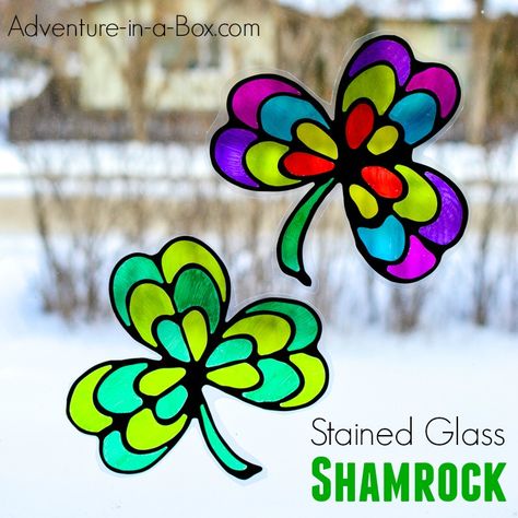 Stained Glass Shamrock Suncatcher - Adventure in a Box Shamrock Suncatcher, March Ideas, Printable Math Games, Stained Glass Cookies, March Crafts, Black Glue, Irish Festival, Pumpkin Template, Quick And Easy Crafts