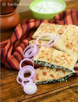 A soft and sumptuous paratha shaped like a lifafa or envelope to hold the tangy and peppy paneer stuffing. Making the flour dough with milk and ghee imparts a crusty and soft texture to the envelope, while the addition of mint, coriander and lemon juice gives the stuffing a zesty feel. Serve the Lifafa Paneer Paratha immediately on preparation with your favourite chutney, sauce, subzi or simply curd. Chutney Sauce, Cheese Paratha, Pickled Recipes, Paneer Paratha, Indian Breads, Indian Flat Bread, Paratha Recipe, Pakora Recipes, Paneer Tikka