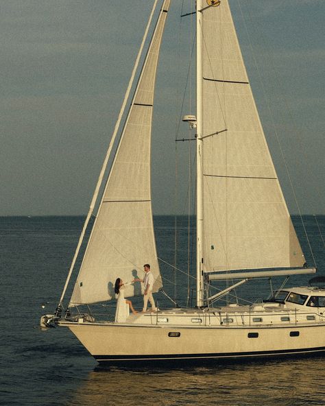 an evening at sea with peyton & caitlin ⛵️ • • • keywords: documentary photography, cinematic photography, visual poetry, storytelling, love, couples photoshoot, tampa elopement, travel photographer, couples inspo, romcom, movie scenes, sailboat, sail, sailboat photoshoot, 🏷️ #floridaphotographer #tampaphotographer #stpeteweddingphptographer #tampaweddingphotographer #destinationweddingphotograoher #stpetephotographer #film #visualpoetry #cinematicphotographer #floridaweddingphotographer ... Sailboat Engagement Photos, Sailboat Engagement Pictures, Traveling Couple Aesthetic, Sailboat Photoshoot, Acadia Elopement, Sailboat Elopement, Tampa Elopement, Couple Poetry, Sailboat Photography