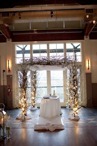 Chuppah - I love the branches on this, and how it's lit from the floor! Winter Chuppah Ideas, Chuppah String Lights, Winter Wedding Chuppah, Chuppah Under Tree, Winter Chuppah, Creative Chuppah, Birch Chuppah With Flowers, Jewish Marriage, Liberty House