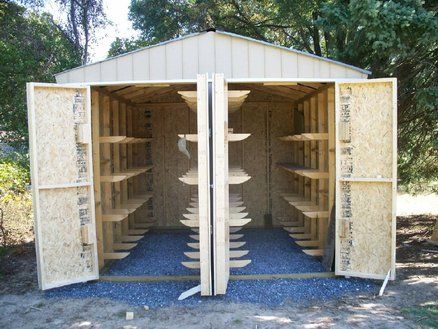 Lumberjock lumber shed "11 feet wide, 12 feet deep and 10 feet high at center...doors are 8' high and swing totally open...108 hangers attached by half-lap joinery, glue and crown staples. I was able to attach the hangers to the outer walls prior to putting the wall together...The centers were all matched, numbered and then attached after the roof went on...the center wall is 2×6 construction because the hangers span both sides ...175lbs of weight on each hanger..." Solar Kiln, Storage Workshop, Lumber Storage Rack, Lumber Rack, Lumber Storage, Wood Mill, Storage Garage, Storage Hanging, Wood Kiln