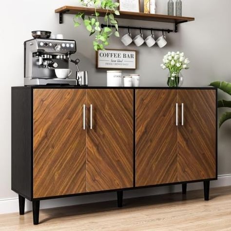 If you are a coffee lover, you must not miss this coffee bar cabinet. The spacious desktop is ideal for placing coffee maker, coffee pods, cups and more. Delicate table runners and creative wall decorations will make the coffee bar cabinet even more special. Use this coffee bar cabinet to create your own coffee corner! Mid Century Modern Coffee Bar, Speakeasy Room, Brickell Apartment, Modern Coffee Bar, Modern Buffet Cabinet, Mid Century Modern Buffet, Black And Gold Living Room, Room Coffee Bar, Mid Century Modern Sideboard