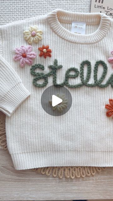 Little Looks by Lilly on Instagram: "Making the winning spring sweater design! What do we think?! I’m loving these colors together; chunky Sage for the name, extra chunky bubble, chunky moon, and chunky pumpkin for flowers! 🌸 you can order this exact design with your Little’s name today during our drop! 0-3m up to 2-4T available for this design #custom #handembroidery #sweater #littlelooksbylilly" Name Sweater, Spring Sweater, Sweater Design, Embroidery Flowers, Chunky Knit, Hand Embroidery, Desi, Bubbles, Moon