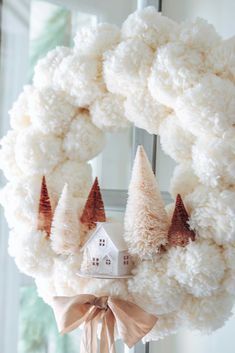 Make this cozy winter wreath in 4 easy steps. Anthropologie inspired DIY wreath. Pom Pom craft. Pom Pom Wreath. Winter Decorating. Winter Wreath. Bottlebrush tree wreath Pom Pom Holiday Crafts, Classroom Pom Poms Decor, Pom Poms On Christmas Tree, Diy Christmas Pom Pom Wreath, Christmas House Wreath, Pom Pom Trees Christmas, Diy Anthropologie Christmas Wreath, Wreath Pom Pom, Anthropologie Wreath Diy