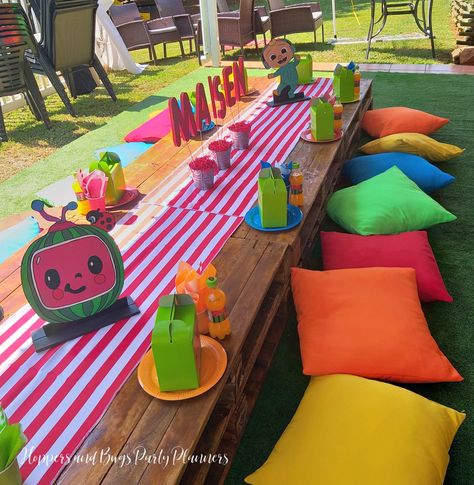 Bright colours used in the setting. Cocomelon Pool Party Ideas, Cocomelon Brunch, Outdoor Cocomelon Party, Festa Cocomelon, Cocomelon Party Table Set Up, Cocomelon Table Decor, Coco Melon Party Ideas, Coco Melon Theme Party, Cocomelon Pastel Color Theme