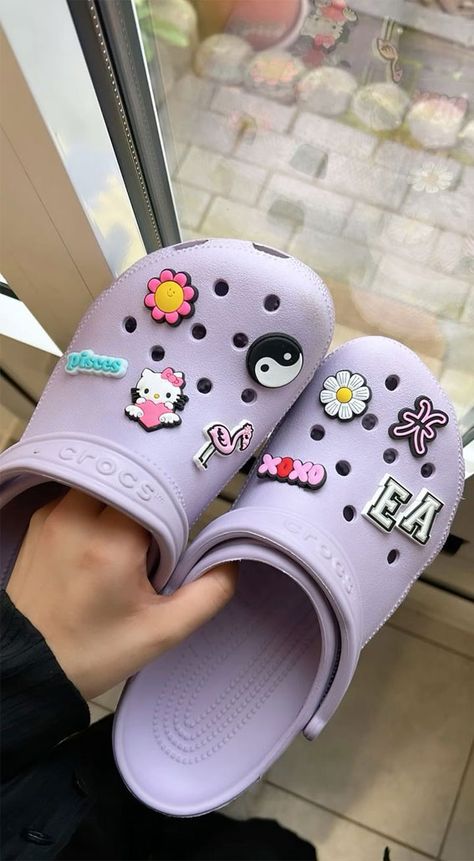 summer crocs, crocs shoes, crocs aesthetic, summer slipper, summer shoes, croc jibbitz,croc jibbitz charm, crocs charm, crocs outfit, summer aesthetic,  summer aesthetic pictures, aesthetic summer vibes, summer vibes Crocs Purple Aesthetic, Lavender Crocs Aesthetic, Lilac Crocs With Charms, Lavender Crocs With Jibbitz, Crocs Pins Aesthetic, Purple Crocs Aesthetic, Croks Slipper Aesthetic, Croc Jibbitz Ideas Aesthetic, Aesthetic Croc Charms