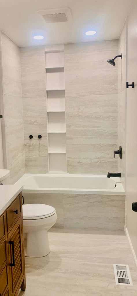 Tub With Tile Walls And Niche, Guest Bath Tile Tub Surround, Bathtub Niche Ideas Built Ins, Tile On Front Of Tub, Bath Tiles Ideas Tub Surround, Tub With Niche Wall, Modern Tub Surround Ideas, 12x24 Tub Wall Tile, Large Tile Tub Shower Ideas