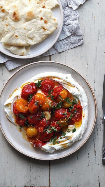 Steph Taylor on Instagram: "Whipped goats cheese with confit tomatoes + garlic Hello hello, it’s been a busy few weeks with lots of freelance work (alongside mum duties!) and i’m oh so aware I haven’t been posting as much in recent months! The good news is i’ve finally been filming and shooting some new recipes to share on here over the coming weeks. First up is this creamy goats cheese and confit tomatoes situation which I could happily mop up daily! There’s a lot of whipped feta around but I prefer to use soft goats cheese, it’s creamier, silkier and lighter in my view. As always do let me know if you give it a try! Serves 2 Ingredients: 1 pack soft rindless goats cheese 1 heaped spoonful cream cheese 1 tbsp greek yoghurt Cherry tomatoes Handful of garlic cloves Olive oil Se Confit Tomatoes, Tomato Confit, Whipped Goat Cheese, Goat Cheese Recipes, Goats Cheese, Whipped Feta, Tasty Foods, Freelance Work, Hello Hello