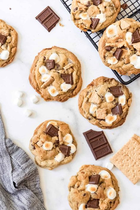 Warm, soft Chocolate Chip S’mores Cookies are a mashup of two classic desserts. Chewy chocolate chip cookies join forces with the summer vacation flavors of toasted marshmallows and graham crackers in one delicious treat! #smorescookies #cookies #smores #best #easy #'smores #homemade #recipe #dessert #marshmallows #grahamcrackers #chocolate Cookies Smores, Cookie Photography, Cookies Photography, Easy Smores, S Mores Cookies, Baking Photography, Cookies Branding, Soft Cookies, Smores Cake