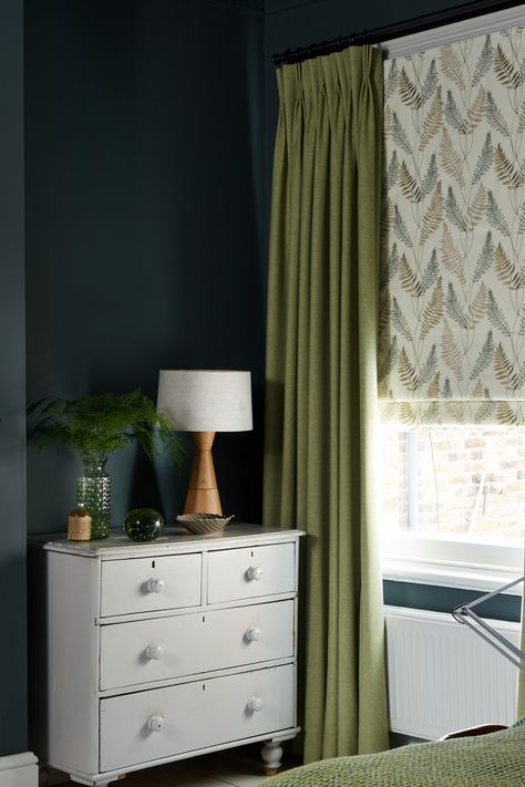 Subtle colours such as these green curtains add soft elements of colour to this boy's bedroom and soften the dark blue wall colour. Green Room Ideas Bedroom Curtains, Dark Green Walls Curtains, Curtain Green Living Room, Curtains On Blue Walls, Blue Walls Green Curtains, Curtains For Dark Green Walls, Blue Wall Curtain Ideas, Colourful Curtains Bedroom, Dark Green Bedroom Curtains