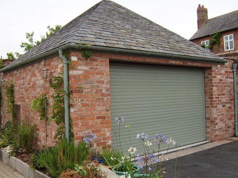 A charwell green electric roller shutter garage door on a modern detached garage. Windows Upvc, Garage Door Colors, Garage Door Paint, Electric Garage Doors, Roller Door, Painting Shutters, Green Shutters, Garage Remodel, Roller Doors