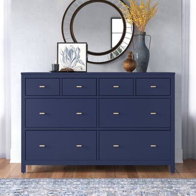 This 8-drawer dresser double dresser adds storage and the right amount of coastal style to your bedroom or guest room. The frame is made from solid and engineered wood with a crisp, versatile finish, and it's accented with sleek T-shaped drawer handles with a gold hue for a distinctive contrast. This dresser features four smaller upper drawers and four wide lower drawers for clothes, extra bedding, and delicates. They're also soft-closing and fully extendable with safety stops. Plus, this dresse Navy Dresser, Drawers For Clothes, Dresser Wood, Blue Dresser, 8 Drawer Dresser, Dresser Sets, White Dresser, White Chests, 2 Drawer Nightstand