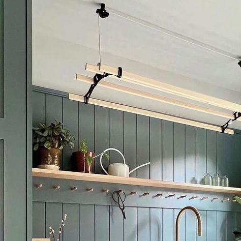 Shaws of Darwen on Instagram: "Measuring 2.7m x 2.15m this small and stylish utility room was part of a two room garage conversion. Meera of @firstsenseinteriors worked with the client to create a space that was as small as possible while still accommodating all their requirements.  As floor space was limited, a host of clever solutions was incorporated, including a pulley clothes airer, stacked laundry appliances and plenty of built in storage.  Painted in @farrowandball De Nimes, the open sink run including our hard-working Butler sink feels open and airy with an oak shelf and peg rail for pretty displays, and counter space for folding clothes.   #shawsofdarwen #farrowandball #farrowandballdenimes #denimes #greenutilityroom #utilityroom #utilityroomdecor #laundryroom #designinspo #housea Stacked Laundry, Oak Shelf, Peg Rail, Victorian Kitchen, Butler Sink, Small Sink, Over Sink, Oak Shelves, Garage Conversion