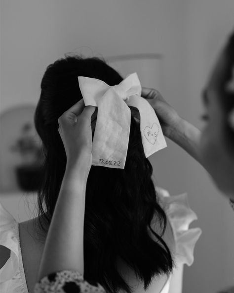 This photo captures a tender and personal moment in the bridal preparation, with the bride’s bow adorned with her wedding date and initials. This subtle yet meaningful detail speaks to the intimacy of the day and the thoughtfulness that went into every aspect. It’s these small touches that tell the bigger story of the wedding, where every element is carefully chosen to reflect the couple’s journey and love. Photo @haute.weddings Planning & Design @qt.weds Accompaniment #marrybylen H&M @... Bridal Preparation, Love Photo, Wedding Event Planner, Destination Wedding Planner, Wedding Date, Intimate Wedding, Wedding Details, The Bride, Wedding Planner